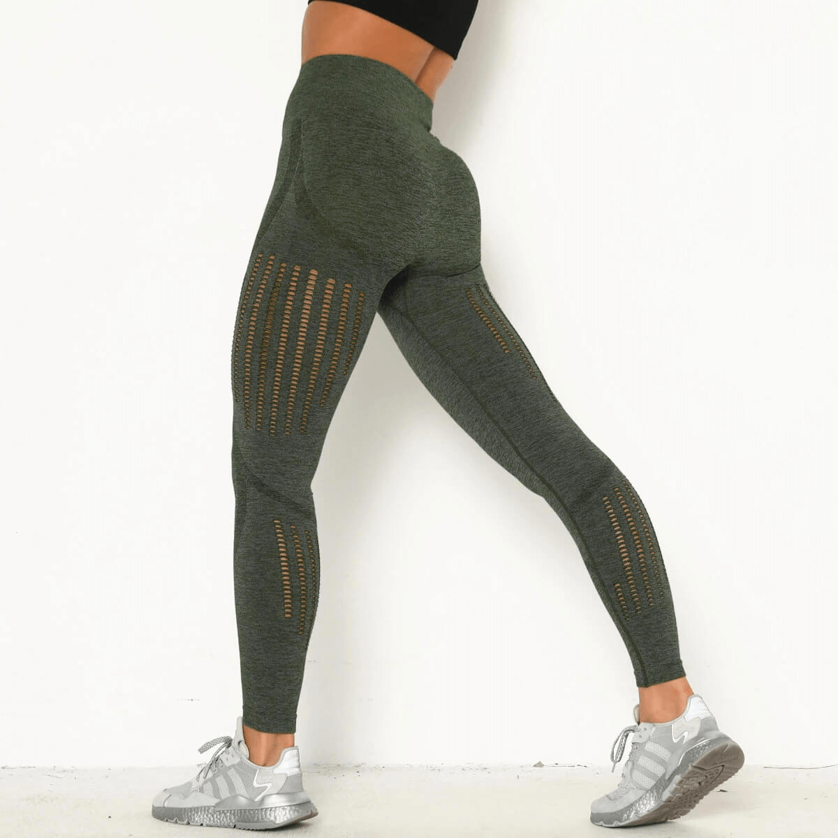 Sexy women's high-waist seamless leggings in green, featuring slimming design and comfortable fit.